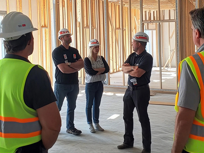 Multiracial construction workers talking at construction site